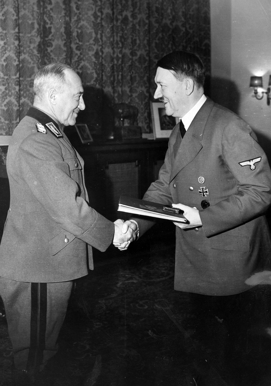 Reichsarbeitsfuehrer Konstantin Hierl gets the Goldene Kreuz des Deutschen Ordens (golden oak leaves with swords, the highest grade of the Deutscher Orden) from Adolf Hitler